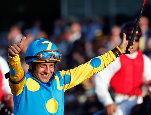 ELMONT, NY - JUNE 06:  Victor Espinoza, celebrates atop American Pharoah #5, after winning the 147th running of the Belmont Stakes at Belmont Park on June 6, 2015 in Elmont, New York. With the wins American Pharoah becomes the first horse to win the Triple Crown in 37 years.  (Photo by Rob Carr/Getty Images)