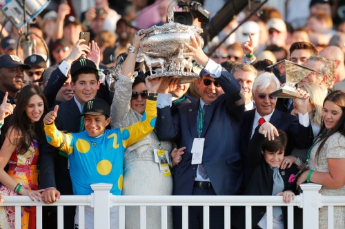 ELMONT, NY - JUNE 06:  Victor Espinoza (L), jockey of American Pharoah #5, owner of Ahmed Zayat, and trainer Bob Baffert (R), celebrate with the Belmont Stakes and Triple Crown Trophies after winning the 147th running of the Belmont Stakes at Belmont Park on June 6, 2015 in Elmont, New York. With the wins American Pharoah becomes the first horse to win the Triple Crown in 37 years  (Photo by Rob Carr/Getty Images)